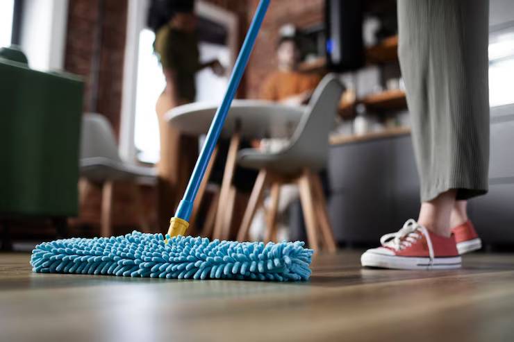 Woman Cleaning a Floor