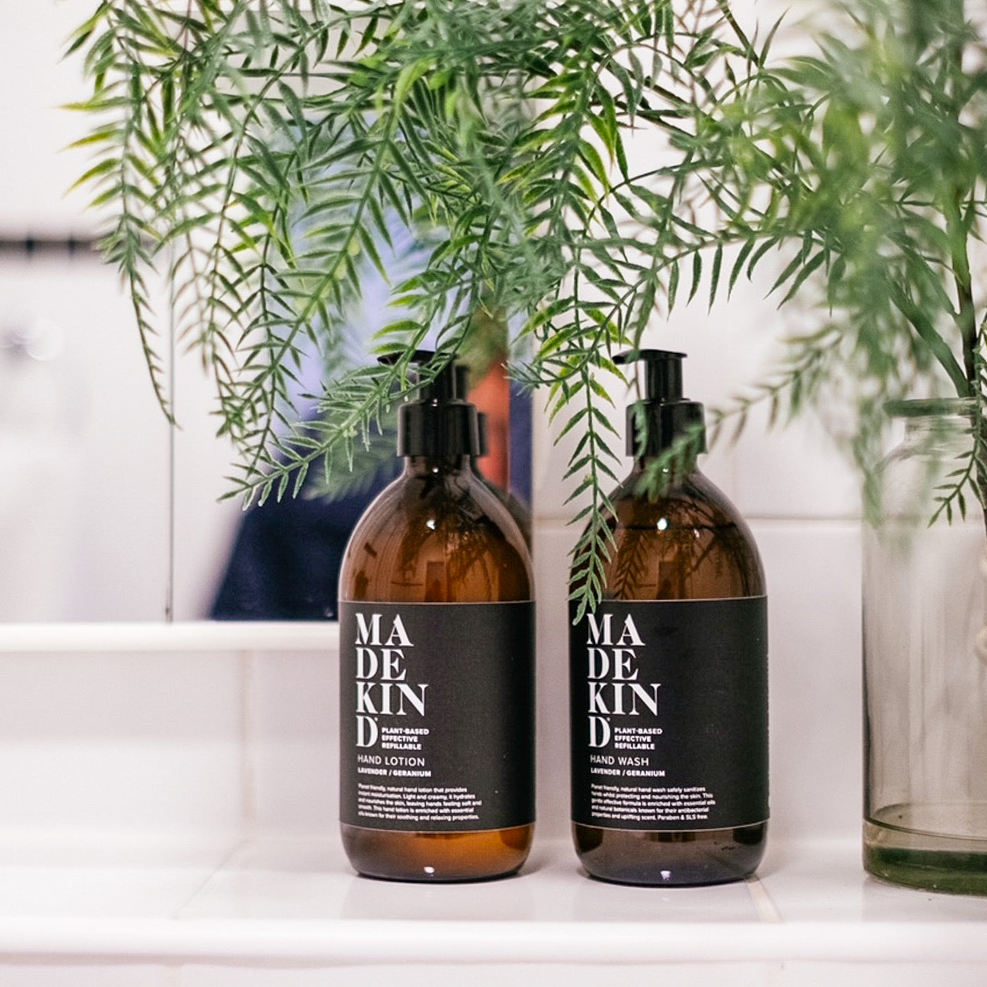 MadeKind Natural Hand Wash & Hand Lotion on a shelf in a bathroom