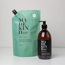 Load image into Gallery viewer, photo of a MadeKind Hand Wash 1 litre refill pouch and a 300ml amber glass bottle of hand wash
