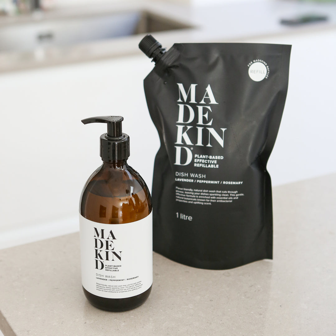 Madekind eco-friendly, sustainable dish wash refillable bottle and refill pouch on kitchen counter