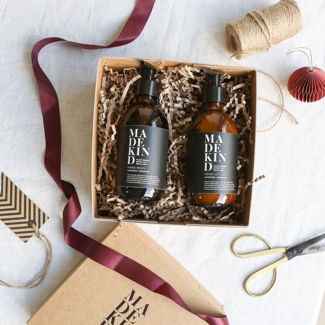 Photo of the MadeKind open gift box with hand wash and hand lotion, and gift wrap