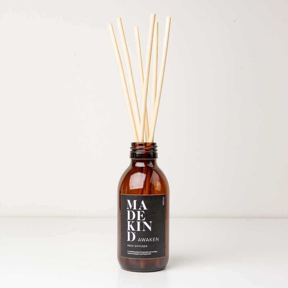 Photo of a MadeKind Reed diffuser with Awaken essential oils and natural reeds