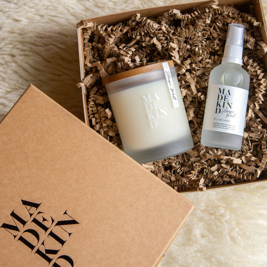 Photo of an aromatherapy sleep candle and pillow mist in a gift box