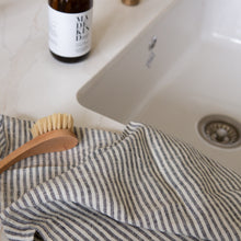 Load image into Gallery viewer, Photo of a striped tea towel next to a kitchen sink

