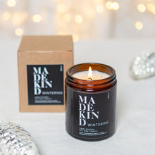 Load image into Gallery viewer, photo of a 180ml madekind wintering candle with gift box and christmas decorations
