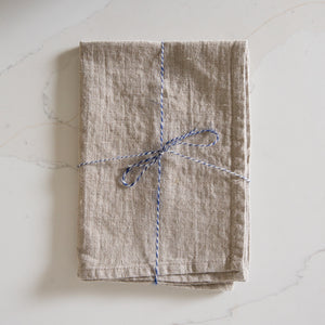 Photo of a Woven Linen Natural Tea Towel on a kitchen island