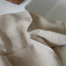 Load image into Gallery viewer, Photo of a woven linen tea towel next to a kitchen sink
