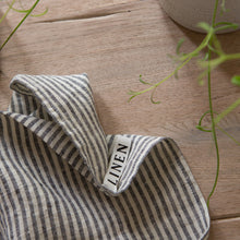 Load image into Gallery viewer, Photo of a woven linen grey striped tea towel on a wooden surface
