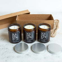 Load image into Gallery viewer, Photo of Three hand poured aromatherapy soy wax candles to give feelings of wellbeing. Each candle is scented with blends of pure essential oils which are known for their beneficial qualities. The three scents of candle are &quot;Focus&quot; which includes Lavender, Rosemary and Eucalyptus to increase parity of mind and focus. Unwind includes Rose, Jasmine and Ylang Ylang to reduce anxiety and stress. Awaken helps you feel revitalised including Lemon, Eucalyptus and Peppermint
