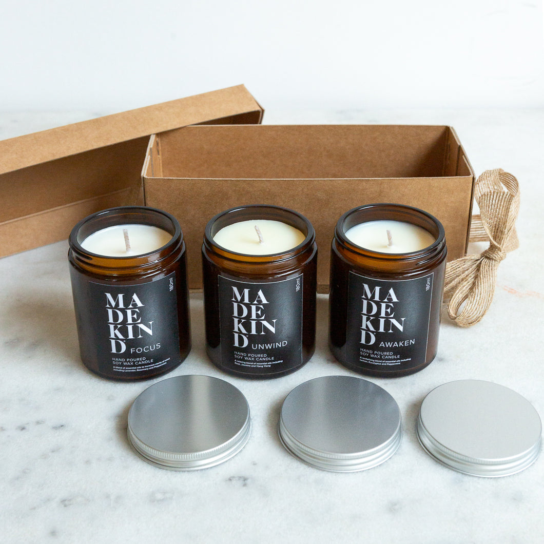 Photo of Three hand poured aromatherapy soy wax candles to give feelings of wellbeing. Each candle is scented with blends of pure essential oils which are known for their beneficial qualities. The three scents of candle are 