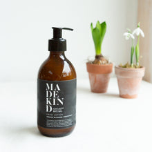 Load image into Gallery viewer, Photo of MadeKind Natural hand lotion with orange blossom and grapefruit essential oils in a 300ml amber glass bottle
