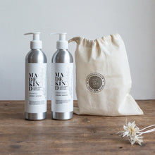 Load image into Gallery viewer, Natural and nourishing hair shampoo and conditioner in refillable aluminium bottles. The best natural shampoo for curly hair. Moisturises and conditions leaving hair cleansed and shiny. Natural, biodegradable ingredients mean it&#39;s kind to the environment and to you. The perfect gift as comes with a free cotton drawstring bag.
