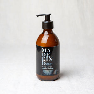 Natural hand lotion in amber glass bottle with lavender and geranium essential oils