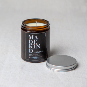 Madekind Unwind Soy wax aromatherapy candle with essential oils in glass container